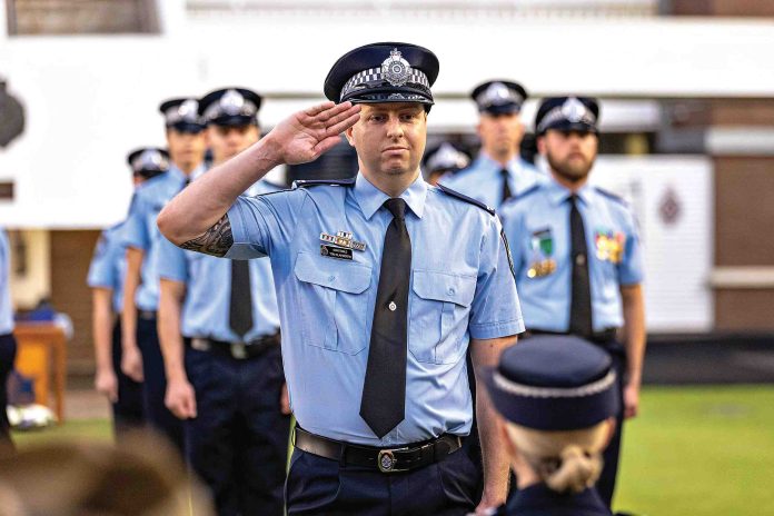 Police recruit saluting